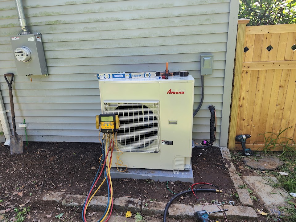 Amana heat-pump outdoor unit being commissioned with test instruments attached